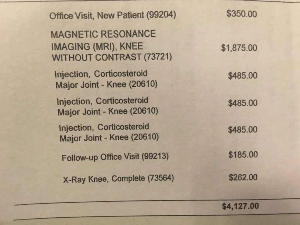 A doctor reviewing patient charts in an office